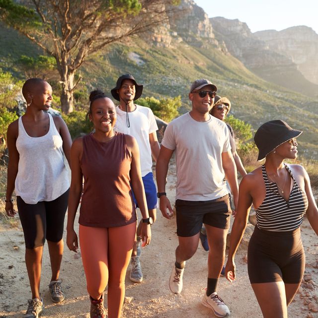 group of people hiking in athletic gear