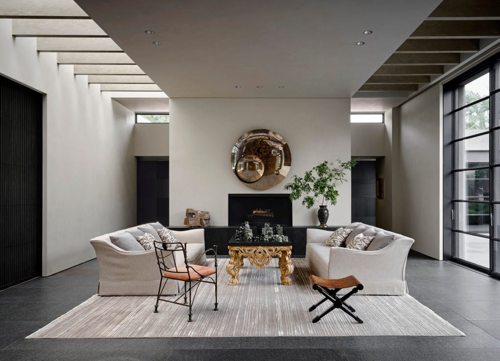 living room with two couches and a large piece of art on the wall