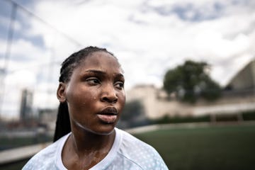 sweaty female soccer player in the field