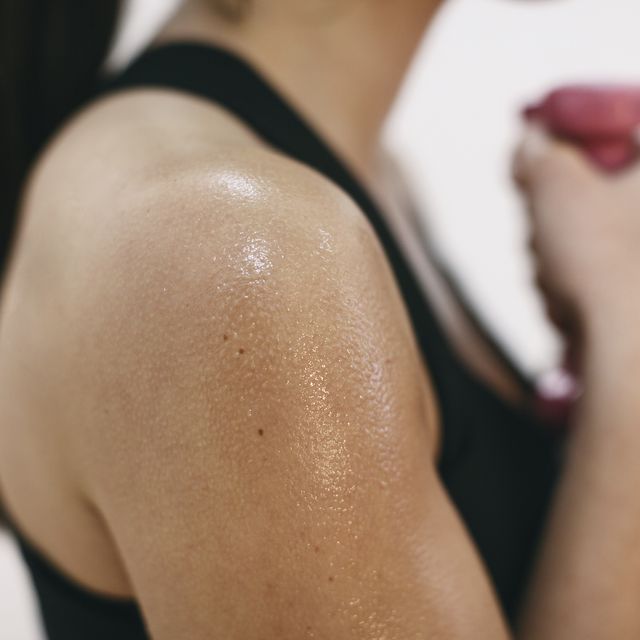 sweaty shoulder of woman doing fitness workout