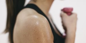 sweaty shoulder of woman doing fitness workout