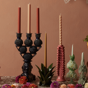 a table with candles and flowers