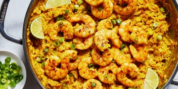rice skillet topped with shrimp and sweet corn