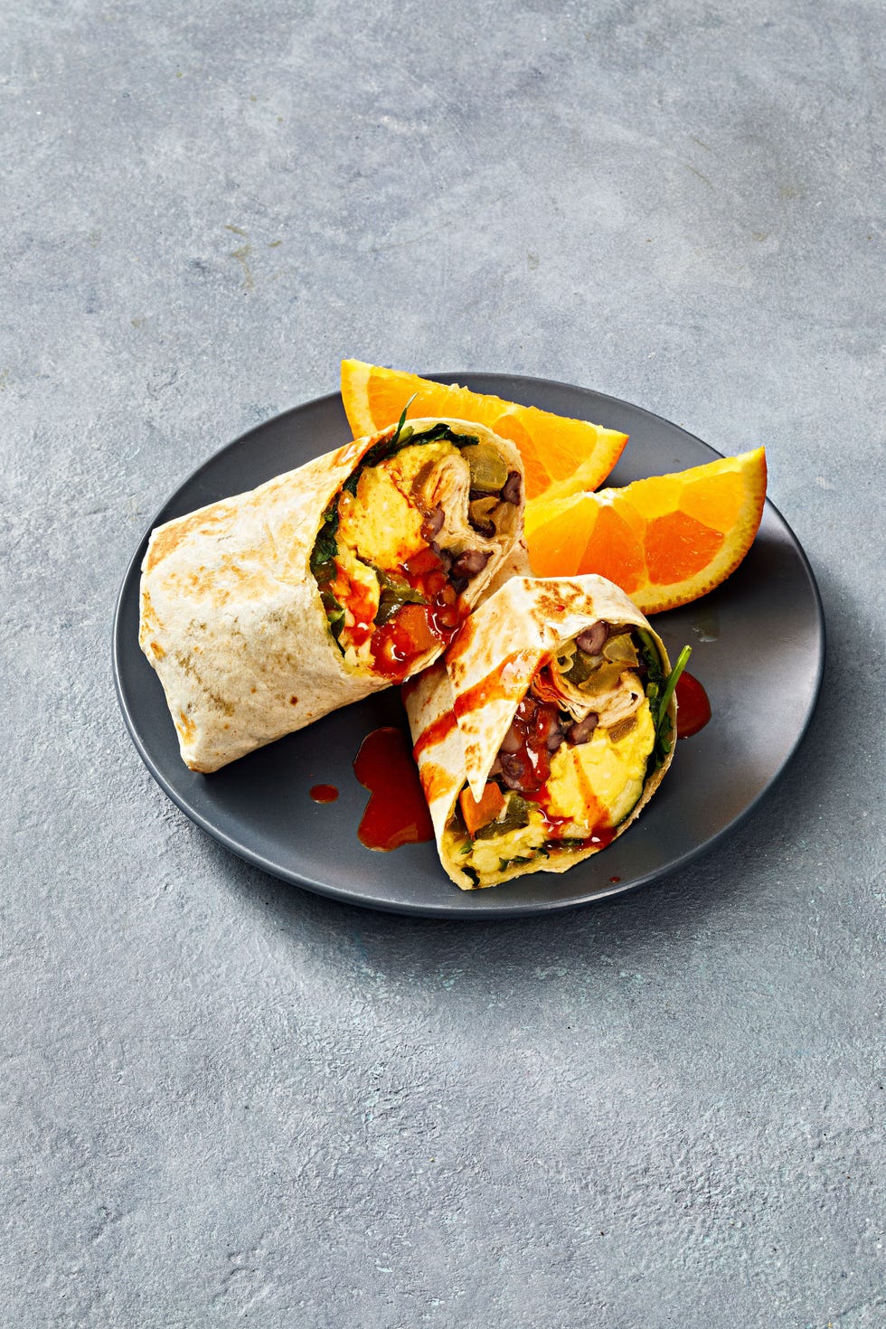 sweet potato breakfast burritos with hot sauce