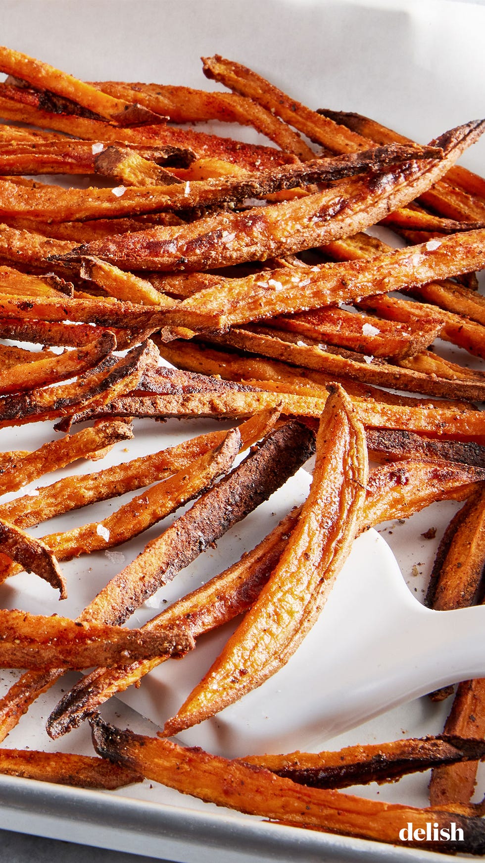 crispy, baked sweet potato fries seasoned with freshly ground black pepper, garlic powder, onion powder, and paprika