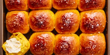 sweet potato dinner rolls brushed with butter