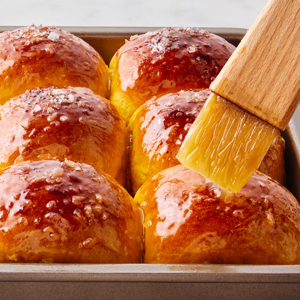 sweet potato dinner rolls brushed with butter