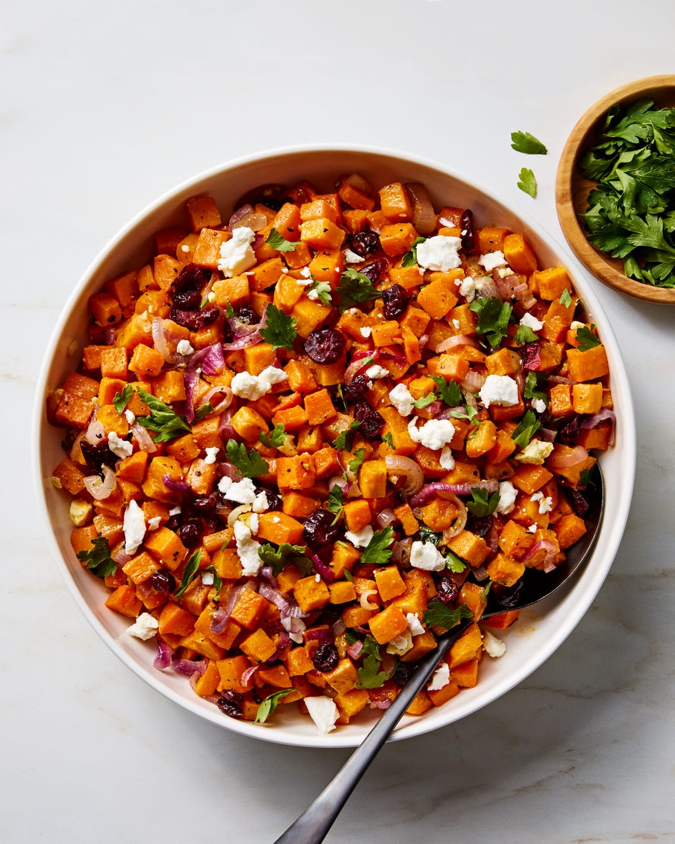 cubes of sweet potato with crumbled feta, red onion, dried cranberries, and parsley