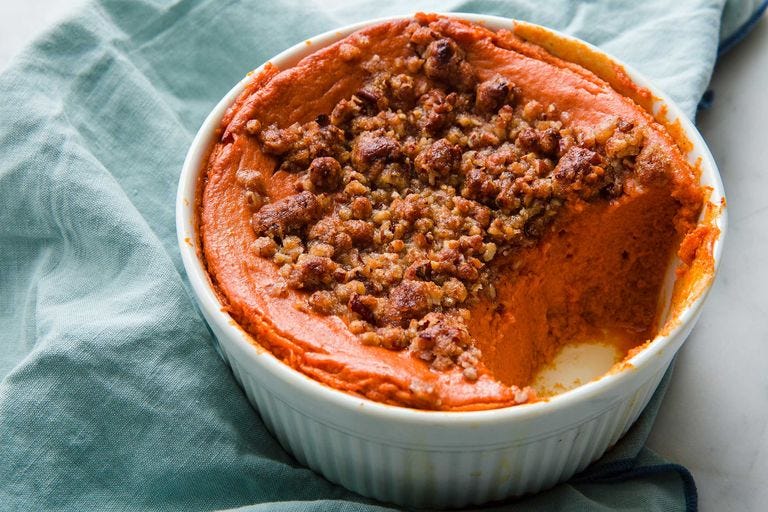 sweet potato souffle topped with a nut crumble in a ramekin