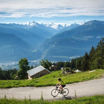 Road cycling through the Swiss Alps. 