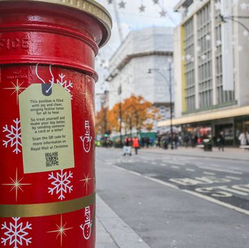 a christmas decorated royal mail postbox in oxford street, london on november 30 2023