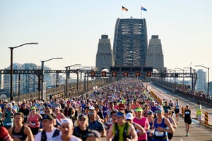 runners crossing the sydney harbour bridge during the sydney marathon