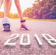 2019 symbolises the start into the new year.Start of people  running on street,with sunset light.Goal of Success