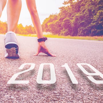 2019 symbolises the start into the new year.Start of people running on street,with sunset light.Goal of Success 2019 symbolises the start into the new year.Start of people running on street,with sunset light.Goal of Success