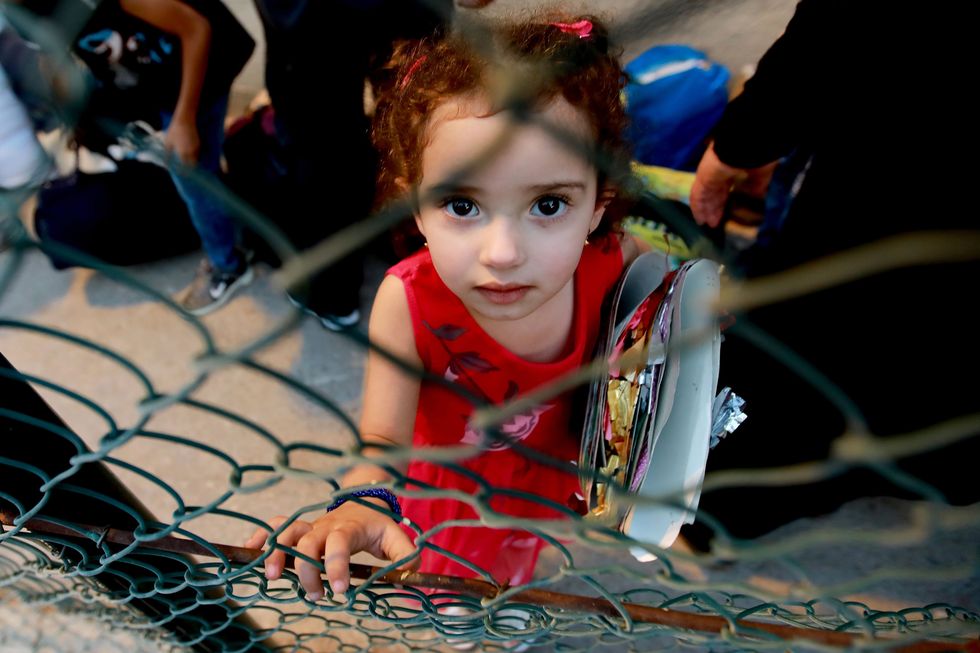 charity rifugiati siriani TOPSHOT-LEBANON-SYRIA-REFUGEE