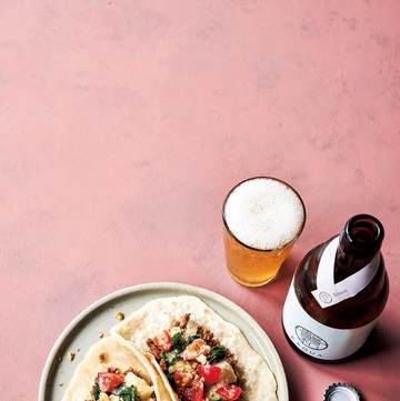 a plate of food and a glass of beer