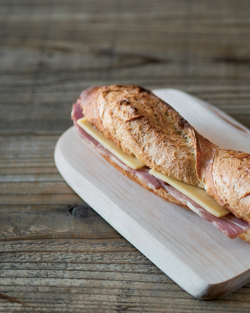 a sandwich on a cutting board