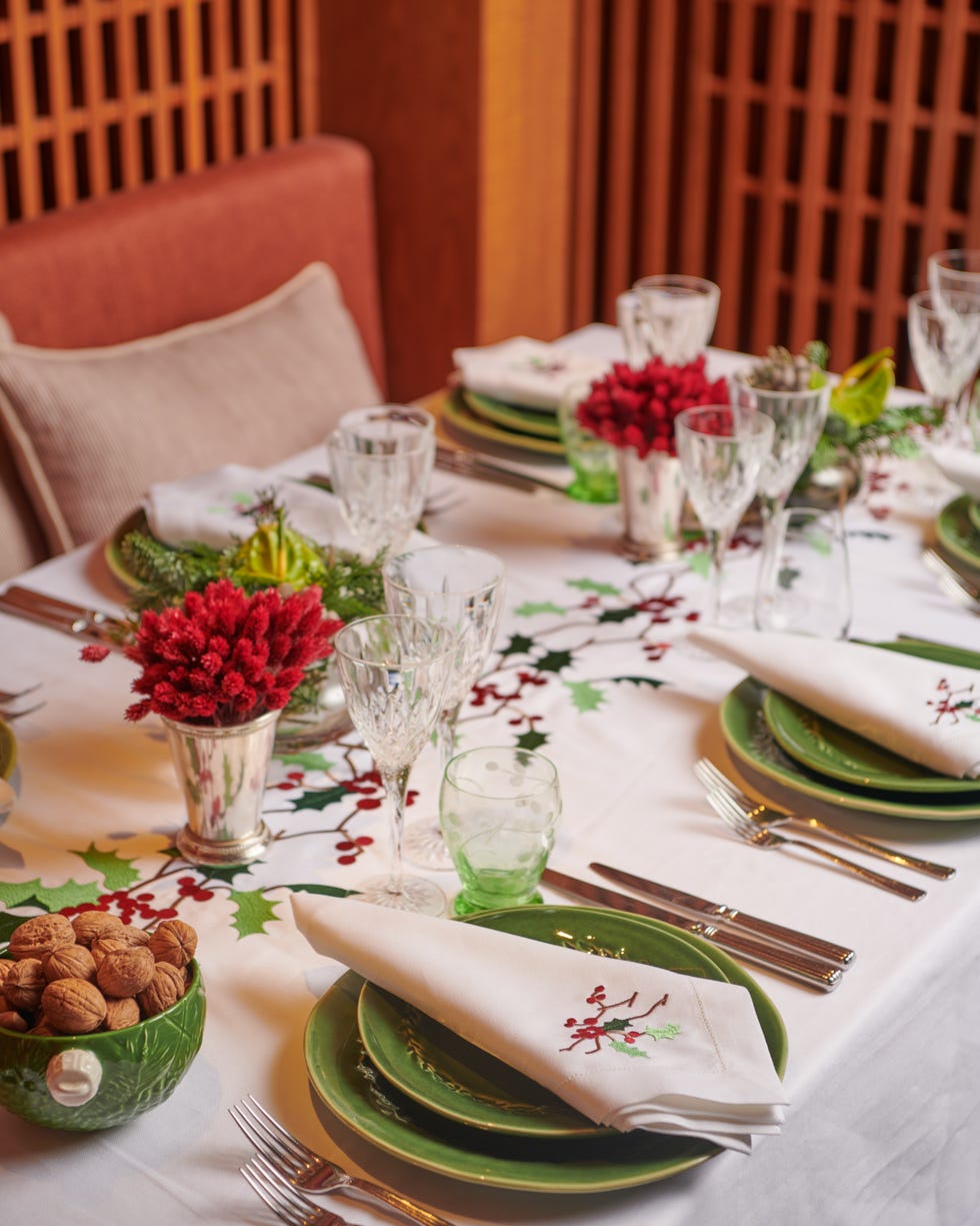 christmas table a table set with plates and glasses