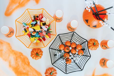 table with halloween decoration and candies