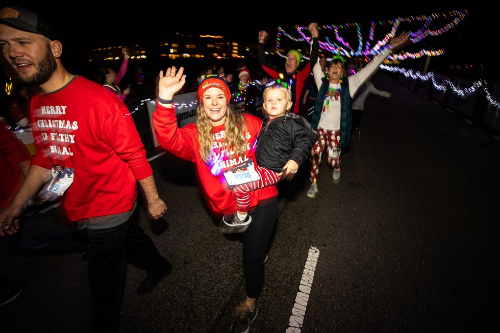 participants celebrating during a night event with festive attire tacky light run
