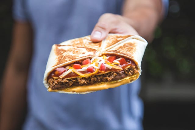 Food, Fast food, Cuisine, Dish, Junk food, Sandwich wrap, Street food, Hand, Ingredient, Gyro, 