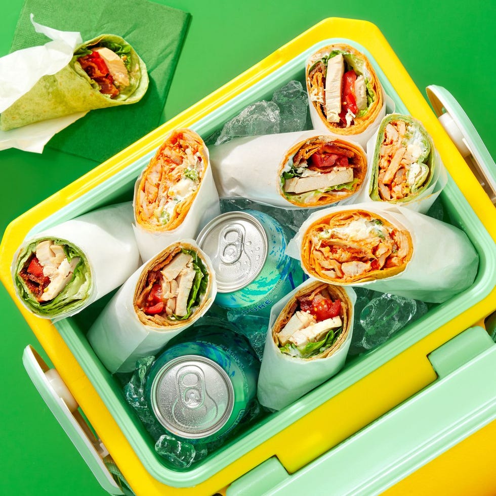 chicken wraps in an ice cooler with drink cans