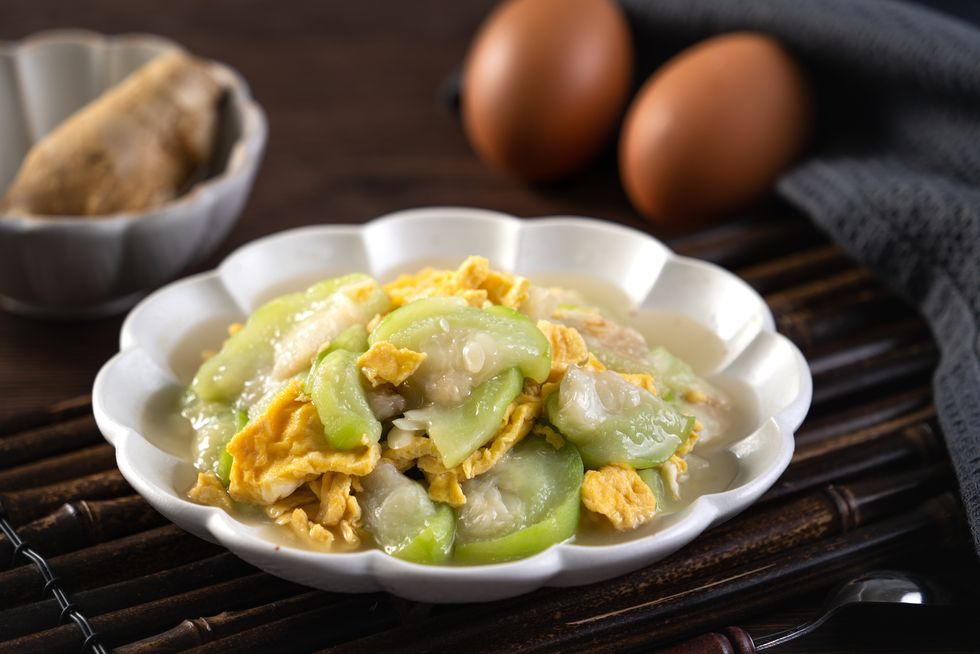 taiwanese homemade local food of scrambled eggs with loofah gourd and sesame oil