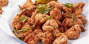 taiwanese popcorn chicken garnished with fried basil