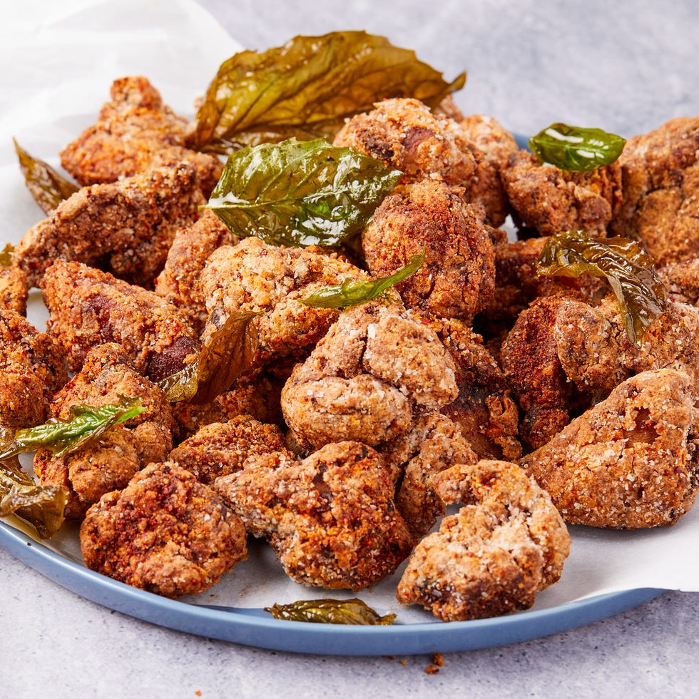 taiwanese popcorn chicken garnished with fried basil