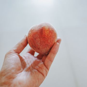 take a peach in one hand