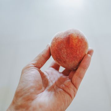 take a peach in one hand
