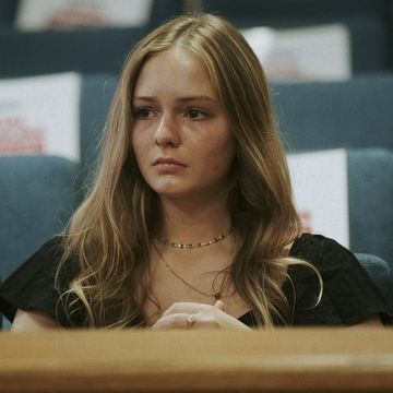 a photo of maya kowalski in a courtroom looking upset