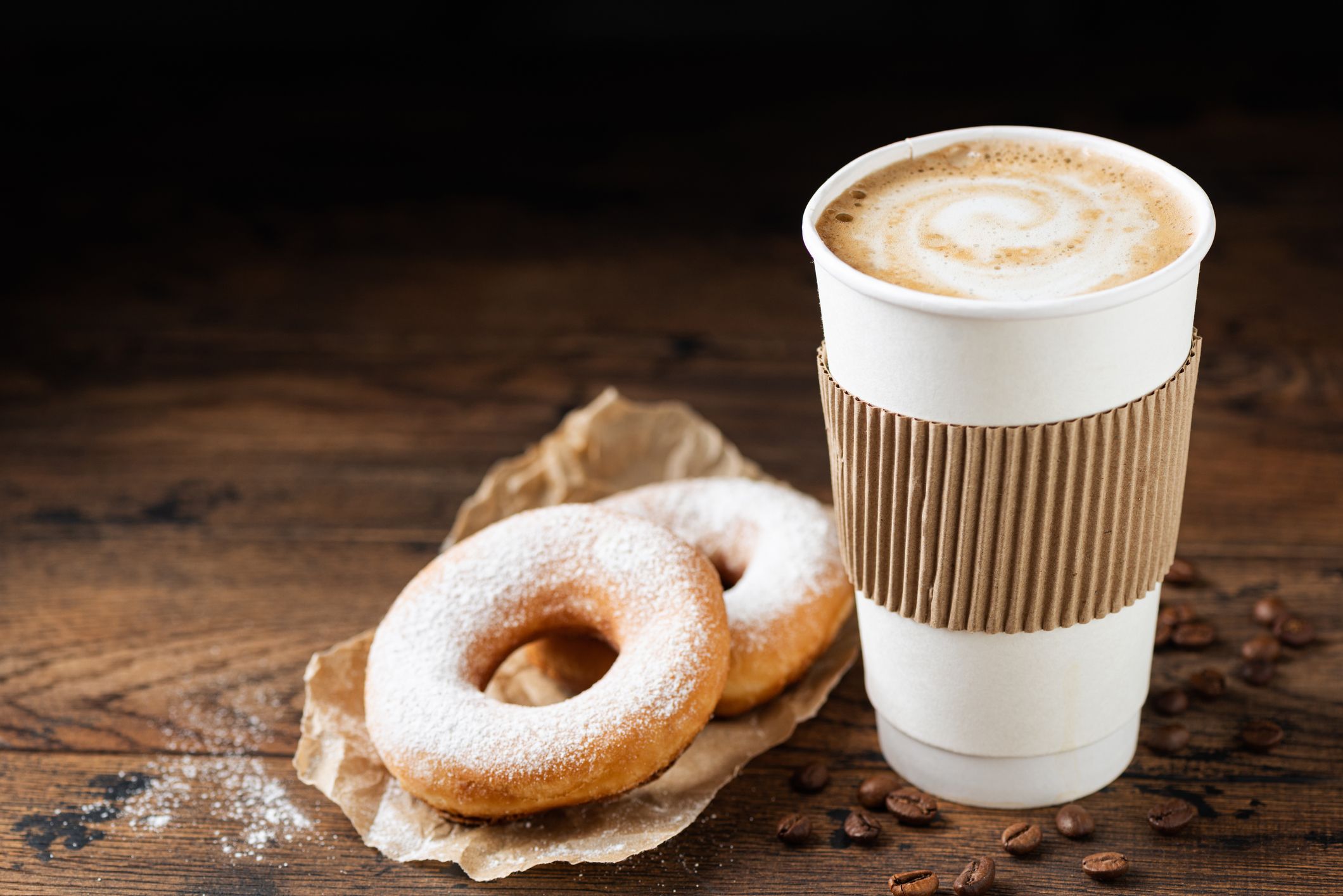 https://hips.hearstapps.com/hmg-prod/images/takeaway-coffee-cup-and-donuts-royalty-free-image-1695909383.jpg