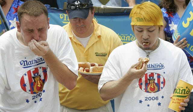 Champion Eaters Compete In Nathan's Hot Dog-Eating Contest
