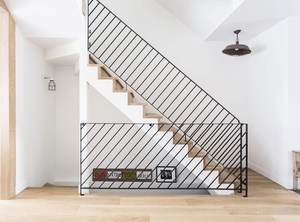 bannister made of metal tubing on a staircase by ﻿taktik design