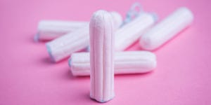 Tampons on pink background