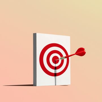 dart in bullseye of target