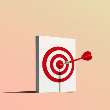 dart in bullseye of target