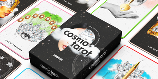 the cosmo tarot deck lies on a white background surrounded by tarot cards