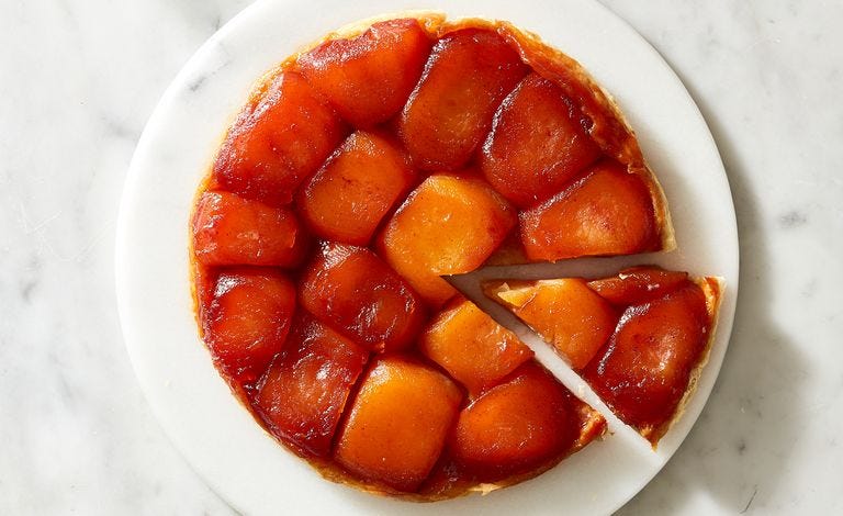 tarte tatin with a slice being pulled out