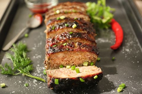 tasty sliced meatloaf on baking tray