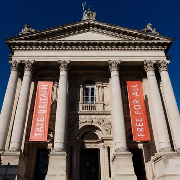 Tate Britain with columns and a sign