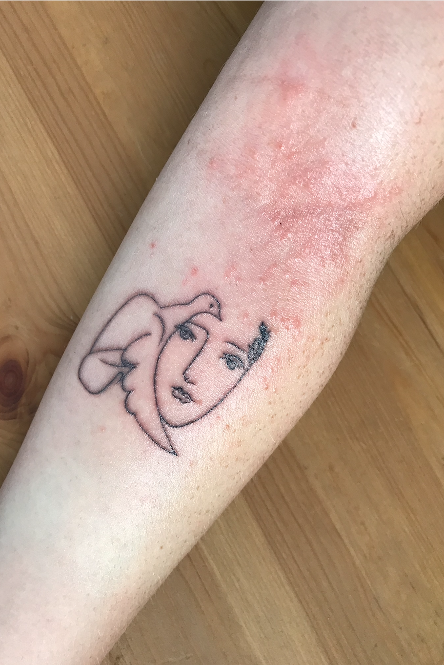 I got a fine line red ink tattoo about a year ago and it's nearly fully  faded. I plan to touch it up, and am curious if it's worth giving red ink