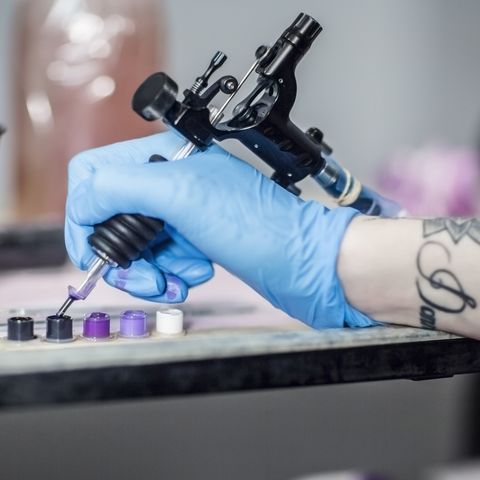 tattoo artist in studio preparing