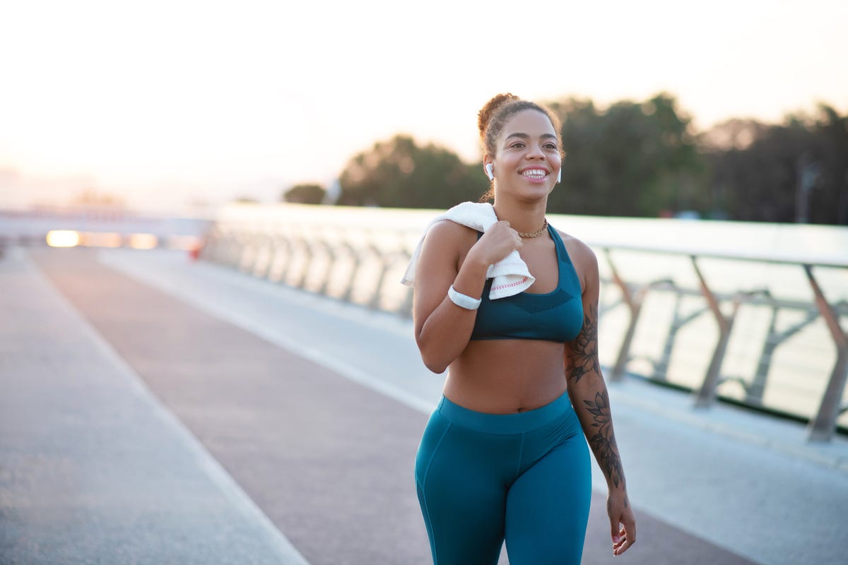 Premium Photo  Fit young woman in short and sports bra jumping with  skipping rope