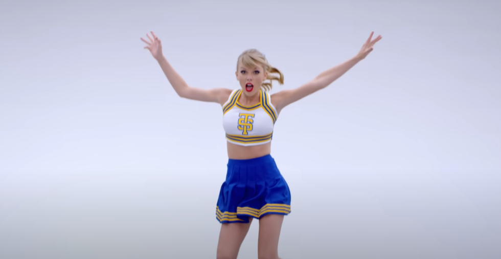 taylor swift in shake it off music video wearing cheerleader outfit