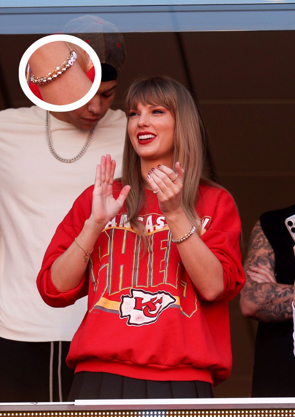 taylor swift wearing her first travis kelce friendship bracelet, featuring his jersey number