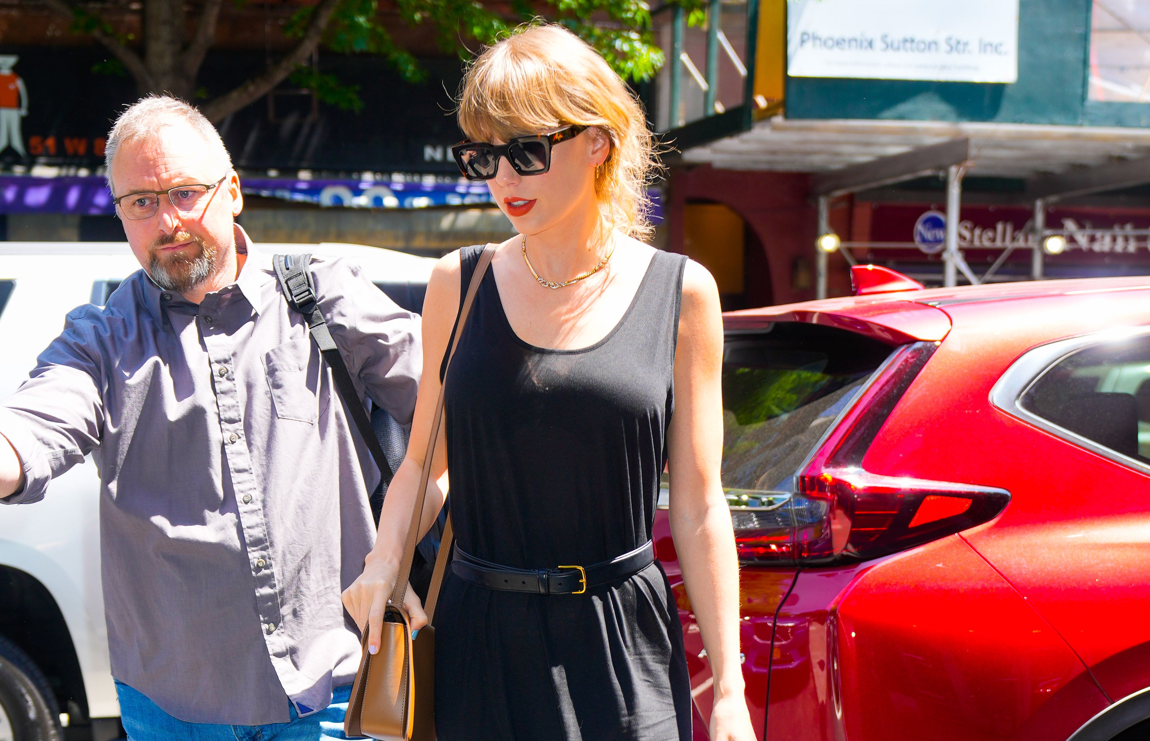 Taylor Swift Wears Belted Black Maxi Dress Wayfarers and Red