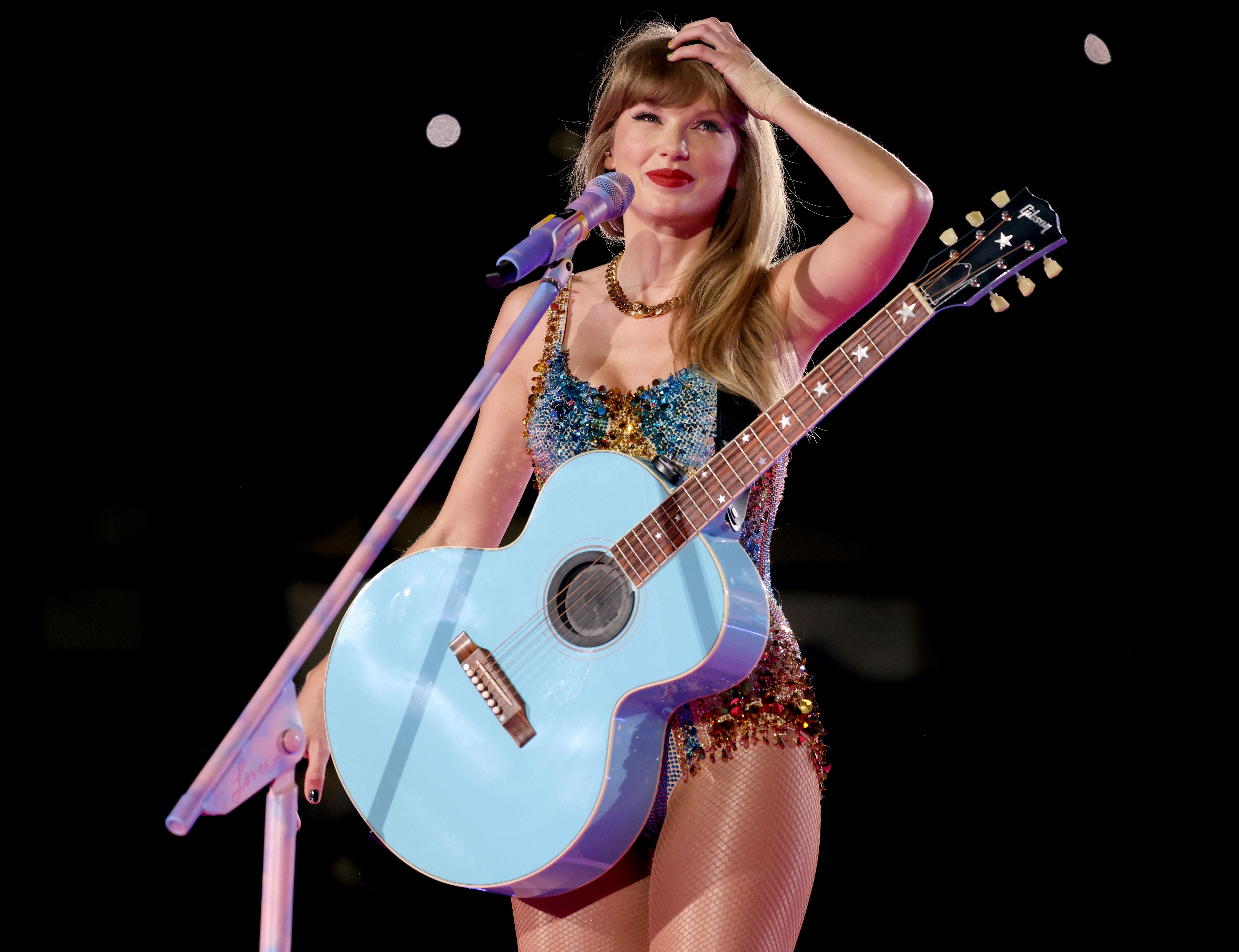 taylor swifts pink guitar