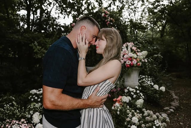 couple embracing in a floral garden